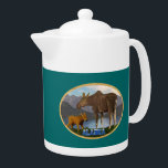 L'orignal dans le pré<br><div class="desc">Une mama orignal et son mignon veau avec un lac et des montagnes au loin. Le texte "Alaska" dans une police enneigée apparaît également. Vous pouvez choisir une autre couleur arrière - plan.</div>