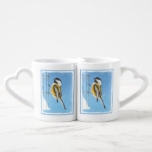 Bickadee sur la peinture d'alimentation - Oiseaux