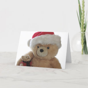 L'ours de Père Noël avec sa petite carte de Noël