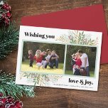 Love & Joy Holiday Green 2 Photo Carte de Noël<br><div class="desc">Cette carte de voeux moderne à plat de Noël offre deux cadres photo avec le texte en gras "Wishing you love & joy". Ce design de vacances est accentué par un graphique de la verdure hivernale de Noël. Photographie © Storytree Studios,  Stanford,  CA</div>