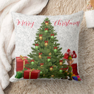 Lutin de Noël près d'un arbre avec coussin décorat