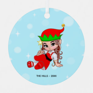 Lutin de Noël tenant un ornement métallique en for