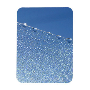 Magnet Flexible Dew Drop sur Spider Web Against Blue Sky