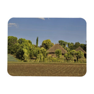 Magnet Flexible Un champ cultivé devant des maisons à toit de chau