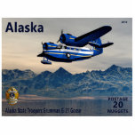 Magnet Photo Sculpture Grumman G-21 Goose<br><div class="desc">Timbre-poste d'un Alaska fictif indépendant représentant un avion amphibie Grumman G-21 Goose en service avec les troupes de l'État de l'Alaska au-dessus de l'eau avec des montagnes dans l'arrière - plan. La lecture de texte, Alaska", "POSTAGE 20 NUGGETS" et "Alaska State Troopers Grumman G-21 Goose" apparaissent également. Le Grumman Goose...</div>