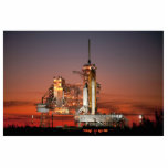 Magnet Photo Sculpture Red Sky for Space Shuttle Atlantis Launch<br><div class="desc">L'air du matin croustillant était électrique avec l'anticipation tandis que les premiers rayons de l'aube peignaient le ciel un rouge vif. La silhouette blanche colossale de la navette spatiale Atlantis domine le tableau de bord, éclipsée seulement par l'immensité du moment. Un souffle collectif s'est répandu dans la foule lorsque des...</div>