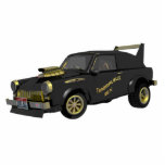 Magnet Photo Sculpture Trabant Est Allemand Personnalisé<br><div class="desc">Une image humoristique, générée par ordinateur, noire et or, d'une voiture Trabant est-allemande customisée. Le surnom du véhicule customisé, "Trabasaurus rex", apparaît à la porte. Le véhicule porte une plaque d'immatriculation Idaho listant "TRABI REX" comme il a été customisé par la mythique Warsaw Pacte Wonder Wheels (Custom Commie Cars) à...</div>