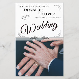 Mains d'un couple gay de mariage avec des anneaux
