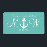 Mariage d'ancre nautique bouteille d'eau étiquette<br><div class="desc">Étiquettes personnalisés bleu turquoise et blanc ancre nautique mariage bouteille d'eau . Modèle autocollant élégant personnalisé avec design d'ancre bateau / bateau. Typographie de script élégant pour les noms de mariée et mariée et message de remerciement. Utilisez comme décor de table classe ou merci pour les invités à la mariage...</div>
