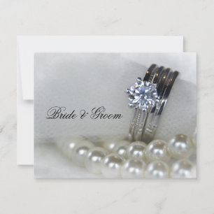 Mariage des anneaux de diamant et des perles blanc