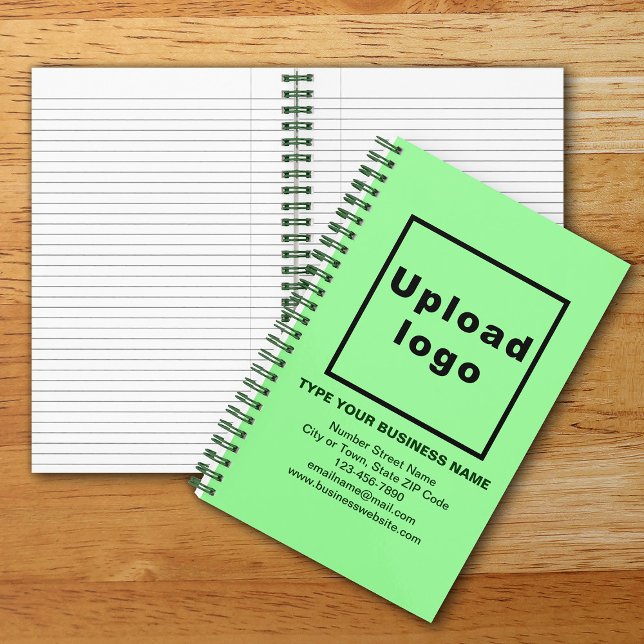 Marque commerciale sur cahier spiralé vert clair (Your business brand on light green spiral notebook. Notebook to build brand name awareness.)