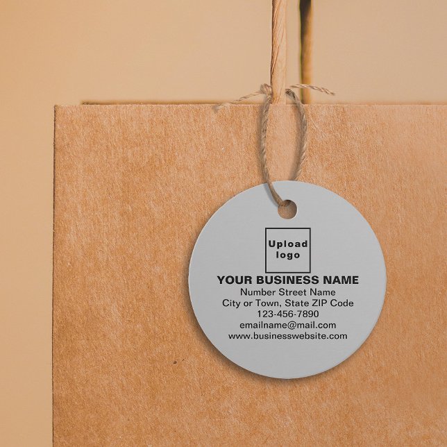 Marque commerciale sur étiquette cercle gris (Gray color round shape tag with your business brand attached on shopping bag.)