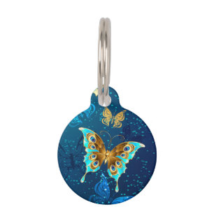Médaillon Pour Animaux Papillons d'or sur un Arrière - plan bleu
