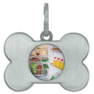 Médaillons Pour Animaux Domestiques Réfrigérateur ouvert rempli de nourriture