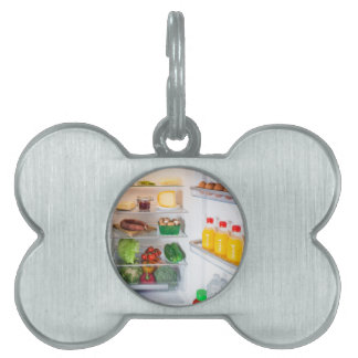 Médaillons Pour Animaux Domestiques Réfrigérateur ouvert rempli de nourriture