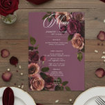 Menu Elegant Moody Soft Rust & Burgundy Floral Wedding<br><div class="desc">Embrace timeless elegance for your gothic-inspired celebration with our captivating small card wedding menu. A soft burgundy wine background provides the perfect canvas for a captivating, yet understated bouquet. Imagine a corner arrangement of muted rose blooms, where soft rust blush and rich burgundy hues mingle with dark green foliage. This...</div>