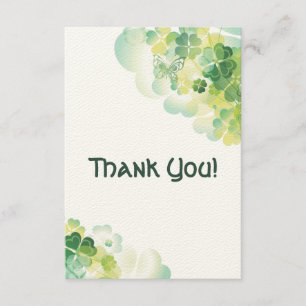 Merci de coins de trèfle vert et de papillon