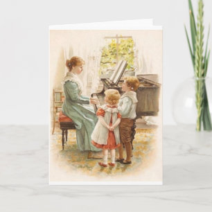 Mère vintage et enfants avec la carte de piano