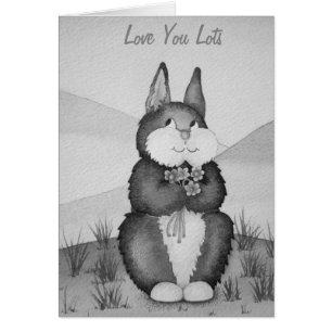 mignon lapin gris souriant avec des fleurs amour