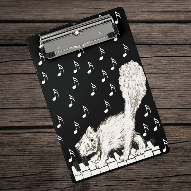 Mini Porte-bloc Dessin d'un mignon chat blanc dansant sur des touc (winking white cat walking on piano white music notes on black keyboard.)