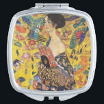 Miroir De Poche Gustav Klimt Lady With Fan Art Nouveau Painting<br><div class="desc">Dame Gustav Klimt avec peintre Art Nouveau Fan Ce demi-portrait d'une belle femme montre un arrière - plan jaune avec des ornements asiatiques, des oiseaux colorés et des fleurs de lotus. La dame porte une robe dans le style d'un kimono imprimé des motifs d'une robe de dragon chinoise. Belle peinture...</div>