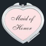 Miroir De Poche Maid of Honor Compact Mirror<br><div class="desc">Miroir compact en forme de coeur avec une couleur arrière - plan rose vif avec texte Maid of Honor en noir. Customisez cet objet ou achetez tel quel.</div>