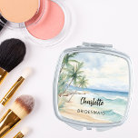 Miroir De Poche Mariage à la plage de Bridesmaid<br><div class="desc">Plage tropicale,  vagues et palmiers,  aquarelle. Personnalisez et ajoutez le nom de votre servante. Script de style manuscrit noir.</div>