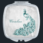 Miroir De Poche Miroir compacte de vigne Peacock turquoise<br><div class="desc">Personnalisez un cadeau unique pour vos Bridesmaids avec un miroir compacte Peacock Leaf Vine Compact Turquoise. Le design compact est composé d'un arrière - plan gris clair et d'un paon turquoise animé avec un embellissement en vigne. Personnalisez-vous avec le nom de la demoiselle d'honneur pour un souvenir précieux de votre...</div>