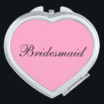 Miroir De Poche Mirror Compact Bridesmaid<br><div class="desc">Miroir compact en forme de coeur avec couleur arrière - plan rose avec texte Bridesmaid en noir. Customisez cet objet ou achetez tel quel.</div>