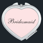 Miroir De Poche Mirror Compact Bridesmaid<br><div class="desc">Miroir compact en forme de coeur avec une couleur arrière - plan rose vif avec texte Bridesmaid en noir. Customisez cet objet ou achetez tel quel.</div>