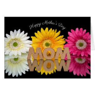 MOM-WOW avec réflexion de fleurs sur miroir noir
