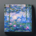 Monet Water Lilies Plaque<br><div class="desc">Monet Water Lilies plaque. Oil painting on canvas from 1916. Monet painted his famous water lily pond obsessively during the final years of his career, drawing inspiration from the light of the sun and its shifting effect on the water and the aquatic flowers and foliage. This painting features a vibrant...</div>