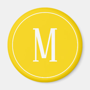 Monogramme blanc sur aimant rond jaune or