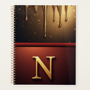 Monogramme de lettre N dorée avec métal qui coule