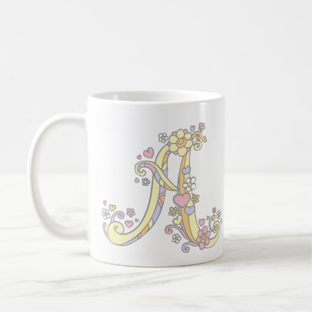 Monogramme décoratif Un coeur et une tasse de fleu (Gauche)