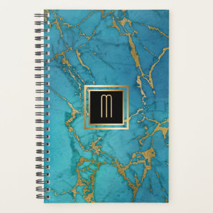 Monogramme doré en marbre bleu
