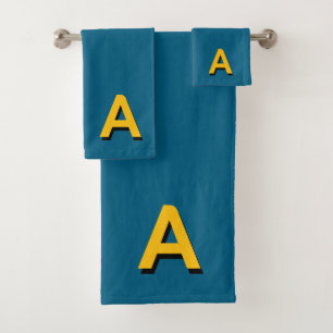 Monogramme jaune doré sur fond couleur lagon bleu