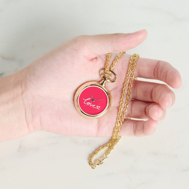 Montre Aimer texte blanc sur rose (main)