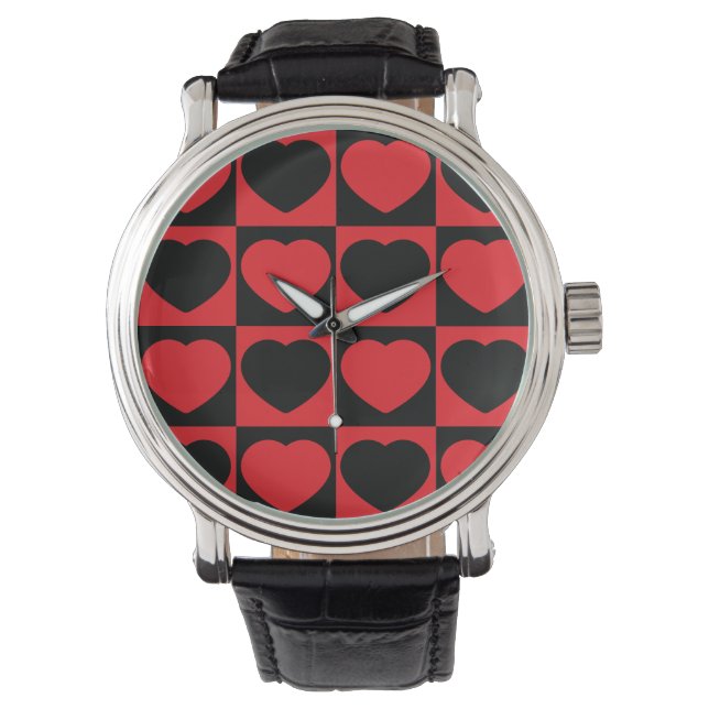 montre au poignet noir et rouge (devant)