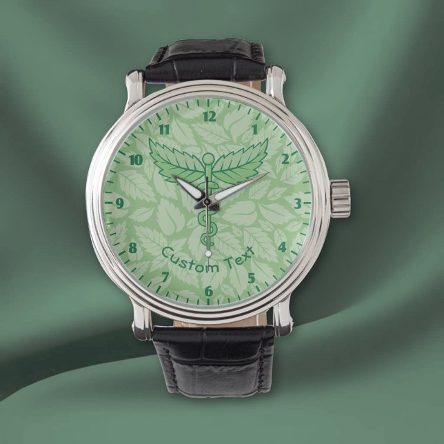 Montre avec caducée et feuilles en arrière-plan (Créateur téléchargé)