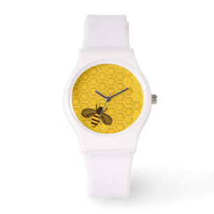 Montre avec le nid d'abeilles et l'abeille d'or