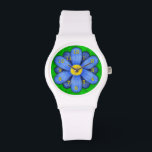 Montre Blue Daisy Flower on Green Beautiful<br><div class="desc">Cette jolie montre à poignets fleurie présente une fleur stylisée originale, dans un style marguerrier et bleu coloré. Les numéros de montre jaune-orange marquent l'heure sur les douze pétales. L'arrière - plan est fait dans un vert pâle abstrait, ressemblant à de l'herbe. Il s'agit d'une montre brillante et audacieuse qui...</div>