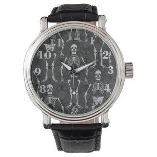 Montre-bracelet noire et blanche de squelettes