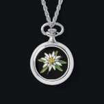 Montre collier Edelweiss<br><div class="desc">En allemand, "edel" signifie noble et "weiss" signifie blanc. Edelweiss symbolise la dévotion, la pureté noble, le courage, l'audace, la liberté et la capacité à surmonter l'adversité. Edelweiss pousse dans certaines des conditions alpines les plus difficiles au monde. Soyez inspiré par ce petit plante sachant que vous avez reçu des...</div>