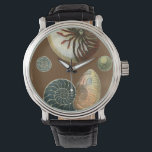Montre Coque de cacao<br><div class="desc">Obtenez cette image unique de coquillage Conch rouge et bleu pilé en pierre sur votre prochain produit. Cet extraordinaire cacao arrière - plan ces deux coquillages uniques. Emmenez la plage avec vous partout où vous allez.</div>