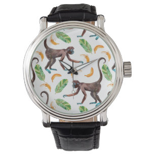 Montre De doux singes qui jonglent avec des bananes