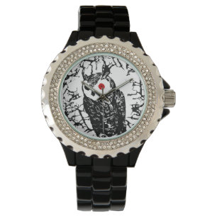 Montre de hibou observée par rouge