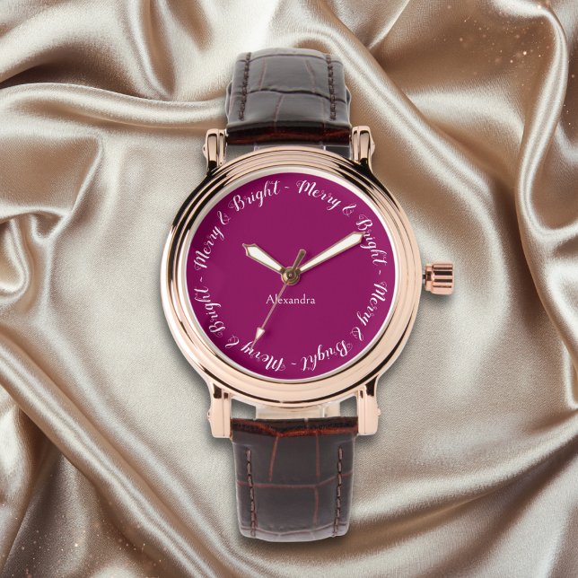 Montre Elégant Joli Chic Stylé Joyeux Noël (An elegant watch with magenta face and 'Merry & Bright' caption around the edge)