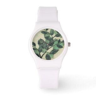 Montre Feuille et branches sur l'arrière - plan crème