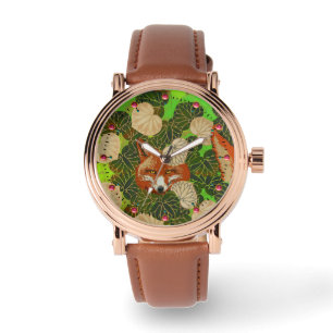 MONTRE FOX ROUGE PARMI LES FEUILLES VERTS ET LE FOLIAGE